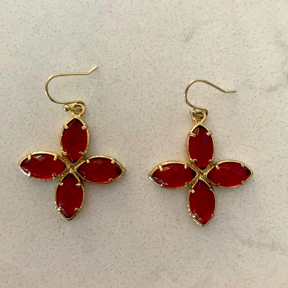Kendra Scott red stone and gold drop earrings.